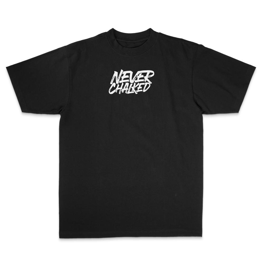 Front of the black Never Chalked Classic Heavyweight Tee with white puff-print graphic